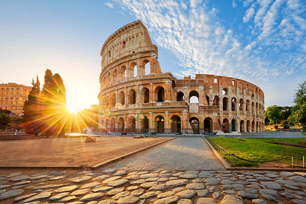 View of Colosseum in Rome and morning sun, Italy, Europe.